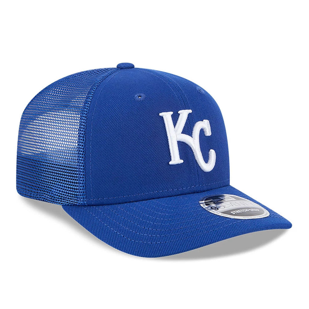 Kansas City Royals MLB Evergreen Blue New Era 9SEVENTY Stretch Snap Adjustable Cap, three-quarter view with raised white KC embroidery on front panel, blue visor and 9SEVENTY size sticker on top, mesh back panels and top button.