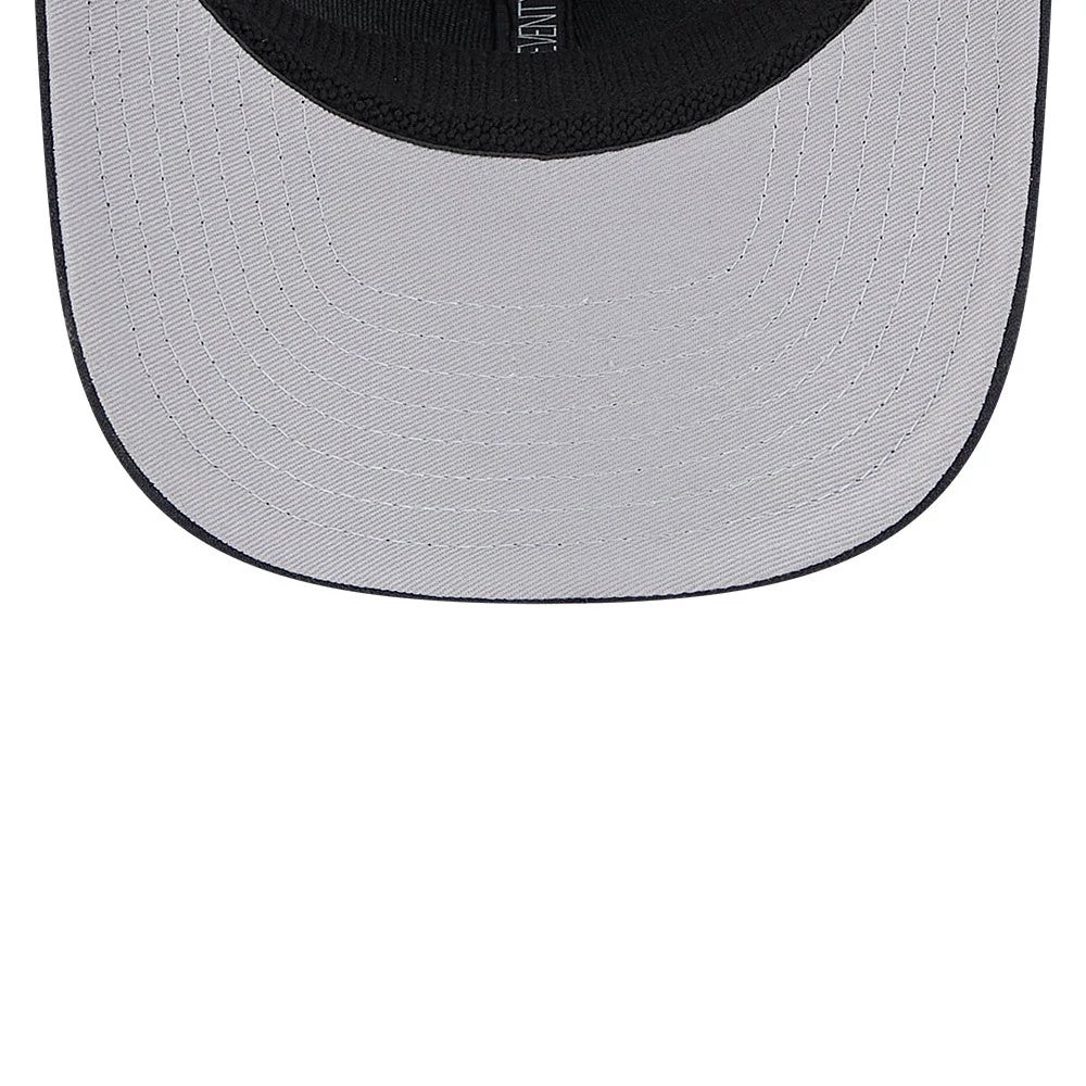 Atlanta Braves MLB Evergreen Navy New Era 9SEVENTY Stretch Snap Adjustable Cap, inside view with a grey undervisor and black sweatband, showing neat stitching and a central woven label.