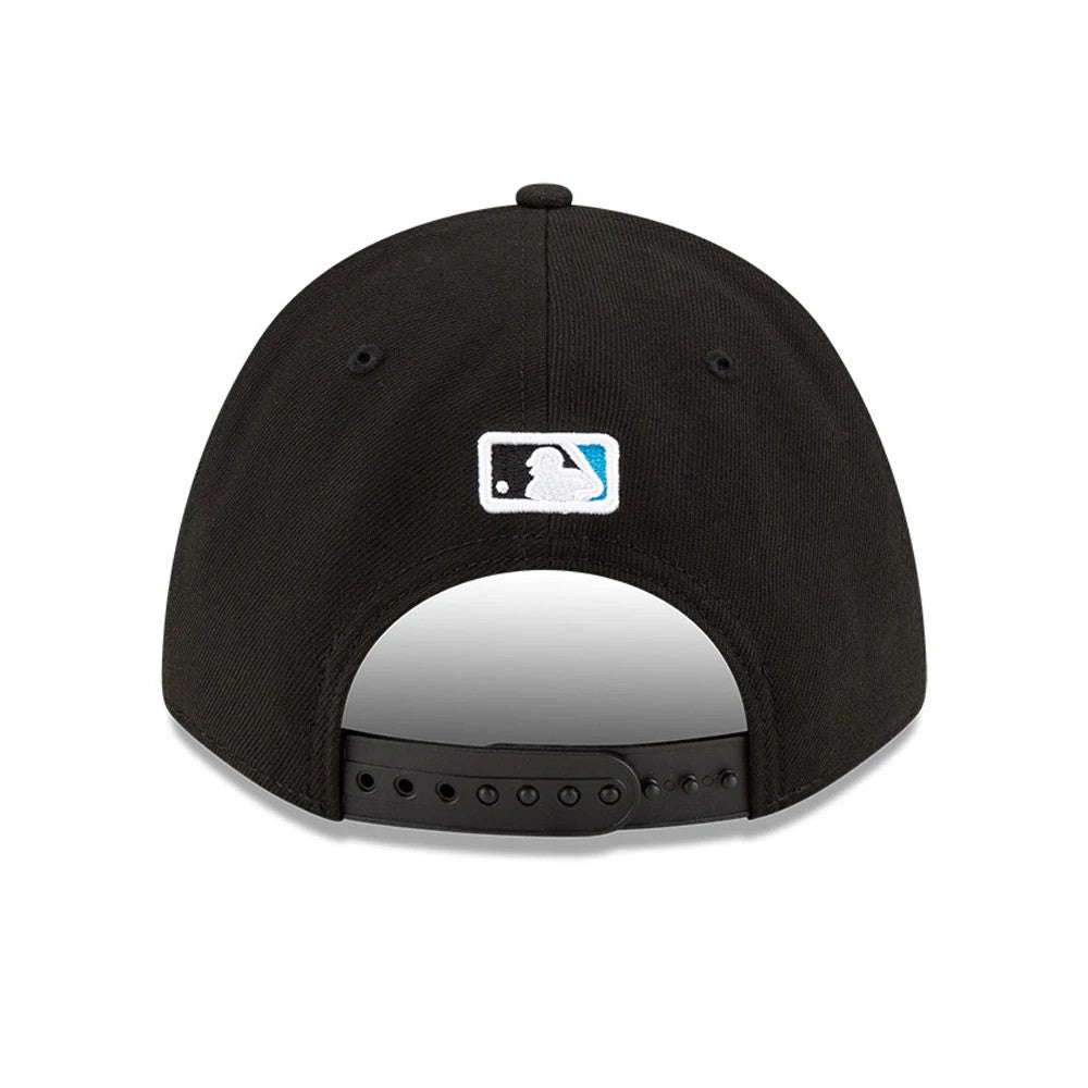 Miami Marlins MLB Player Replica Black New Era 9FORTY M-Crown Adjustable Cap, rear view showing the embroidered MLB Batterman logo in white, black, and blue at the centre back, adjustable black strap and top button on the black crown.