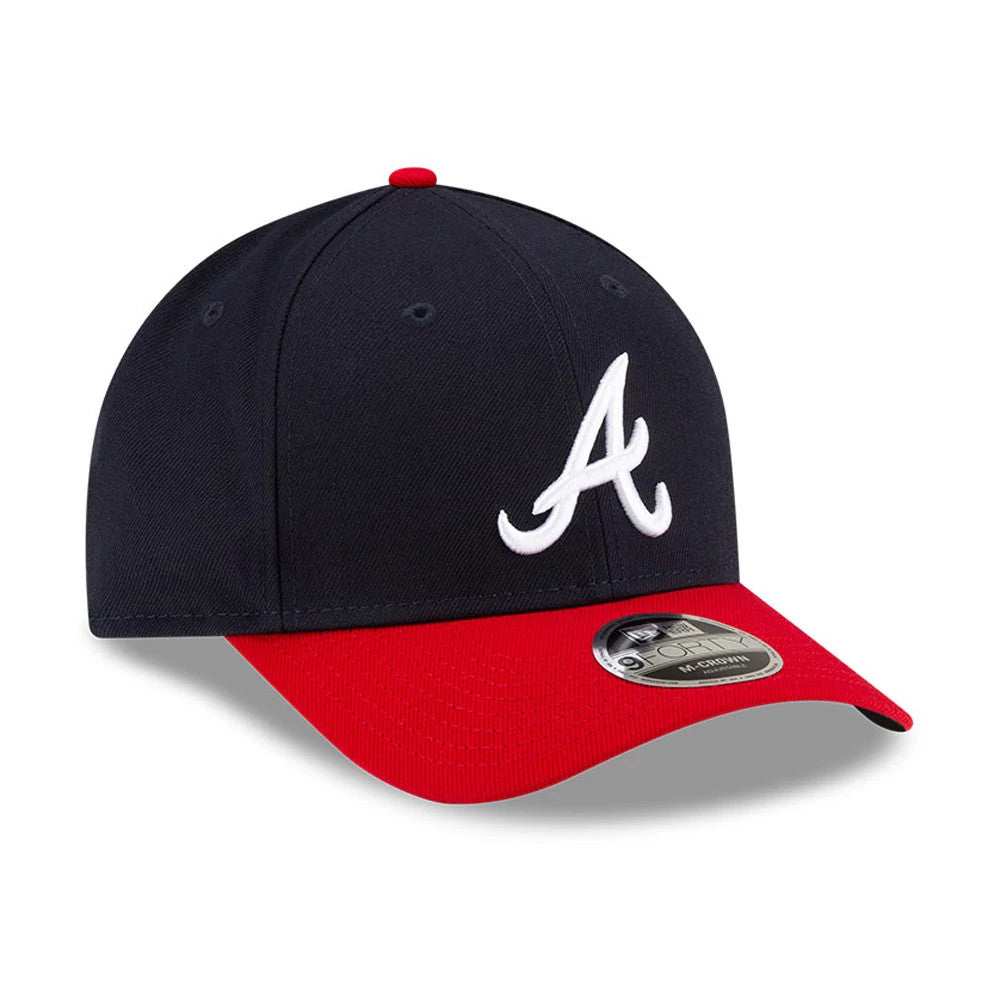 Atlanta Braves MLB Player Replica Navy New Era 9FORTY M-Crown Adjustable Cap, three-quarter view showing the white raised embroidered A logo on the front panel, with a red visor and a 9FORTY size sticker.