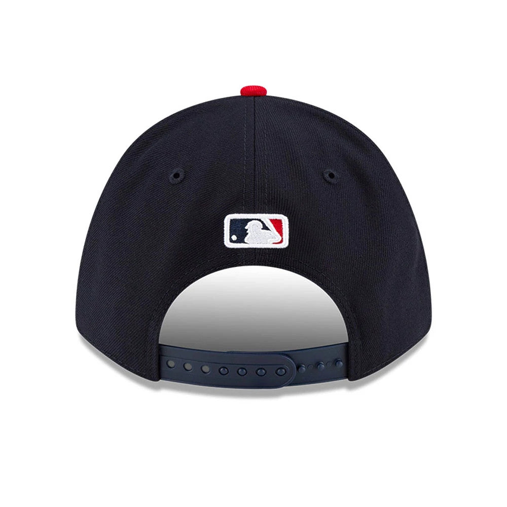 Atlanta Braves MLB Player Replica Navy New Era 9FORTY M-Crown Adjustable Cap, rear view showing the white MLB Batterman logo centred on the navy back panels, with a red top button and an adjustable navy strap.