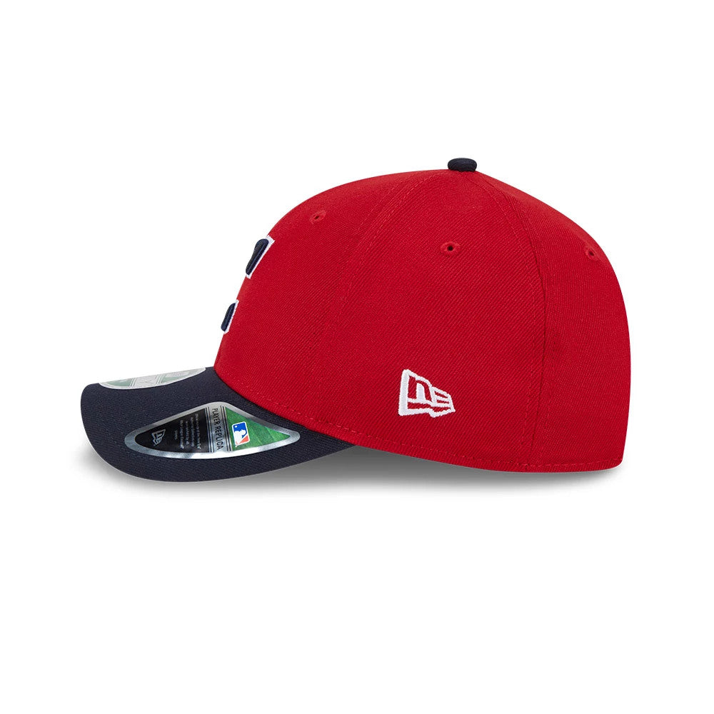 Cleveland Guardians MLB Player Replica Red New Era 9FORTY M-Crown Adjustable Cap, side view showing the embroidered New Era flag logo on the left side of the red crown, with a curved navy visor and 9FORTY size sticker.