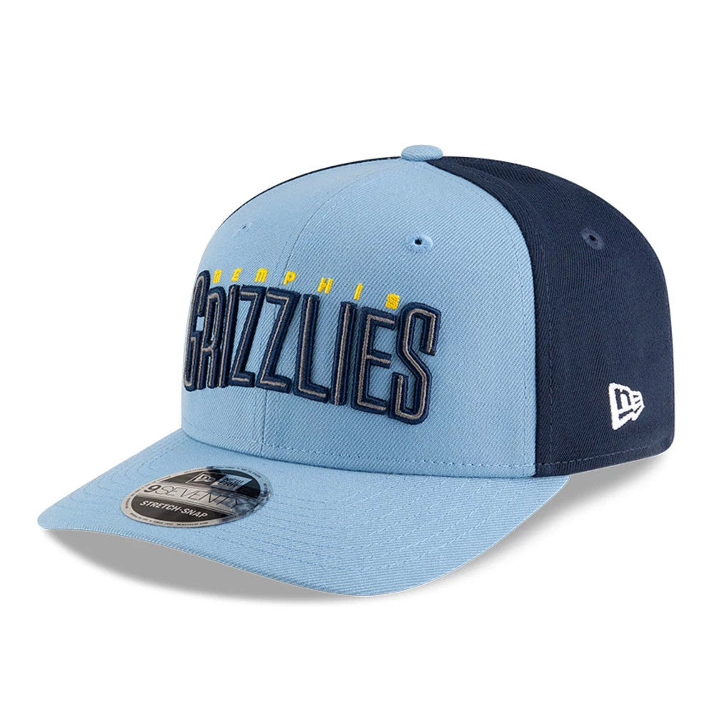 Memphis Grizzlies NBA Statement Pastel Blue New Era 9SEVENTY Stretch Snap Adjustable Cap, three-quarter view showing raised blue Grizzlies lettering on the front panel, contrasting dark blue rear panels and a 9SEVENTY size sticker on the visor.