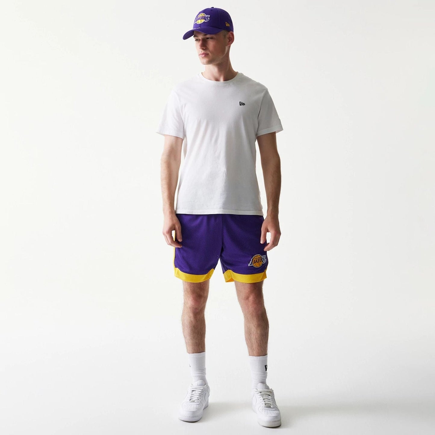 The Male model is wearing LA Lakers Sport Classic Purple Shorts 8