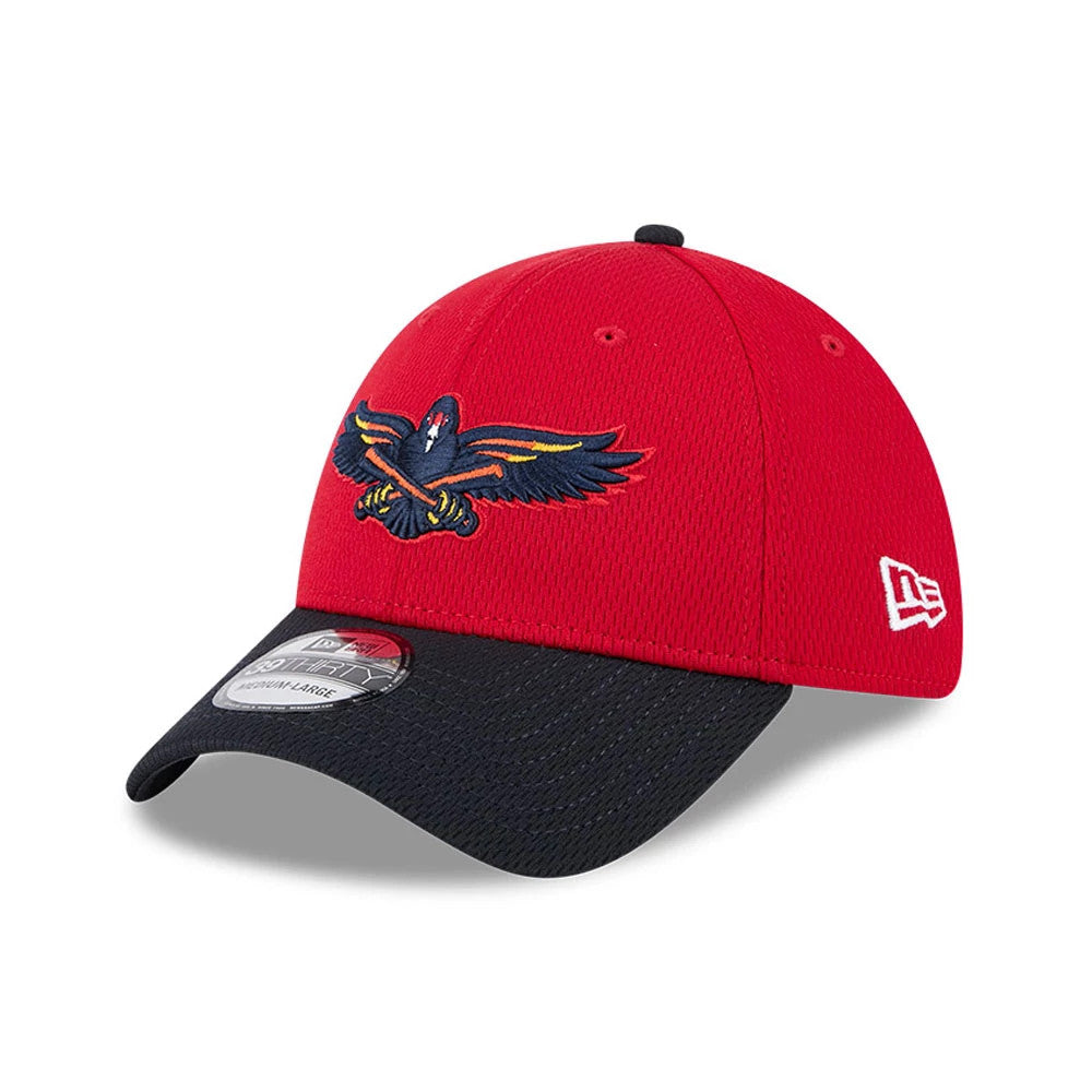 Toledo Mud Hens MiLB Batting Practice Red New Era 39THIRTY Stretch Fit Cap, three-quarter view showing an embroidered Mud Hens logo on the red front panel, with a black visor and white New Era flag logo on the left side.