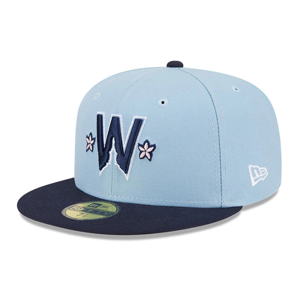 Washington Nationals MLB City Connect Light Blue New Era 59FIFTY Fitted Cap, front view showing a navy embroidered W logo with pink flower details on the light blue crown, a navy visor and a gold 59FIFTY size sticker.