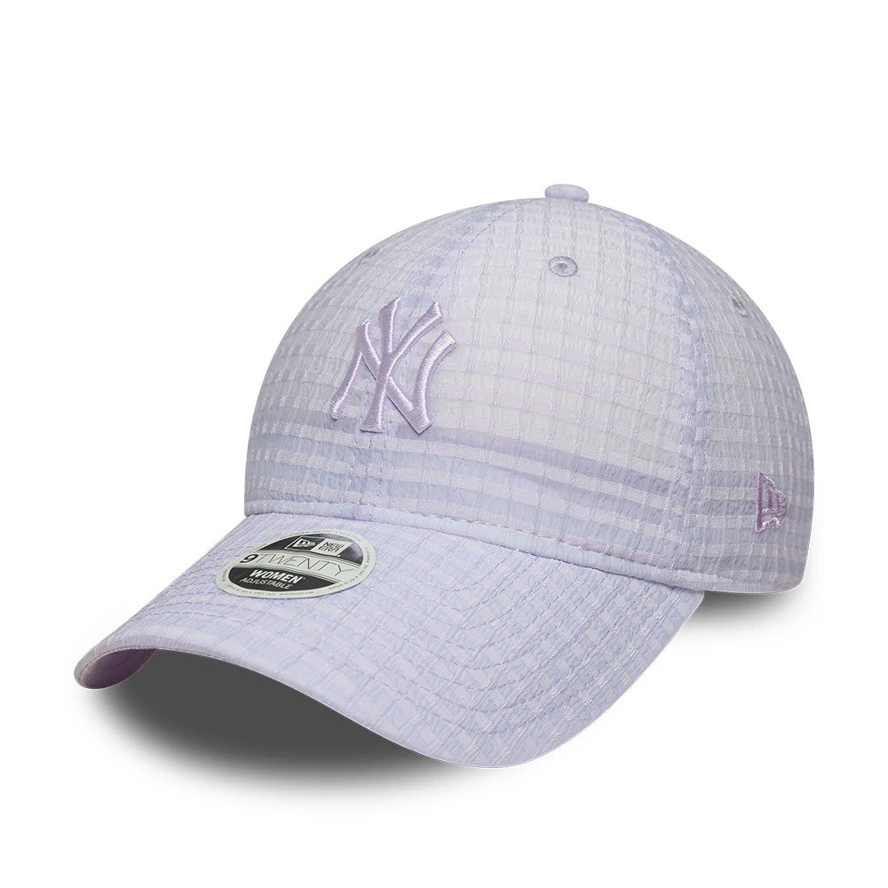 New York Yankees Womens MLB Seersucker Pastel Purple New Era 9TWENTY Adjustable Cap, three-quarter view showing the purple embroidered NY logo on the front panels, curved visor with 9TWENTY size sticker and New Era flag logo on the left side.