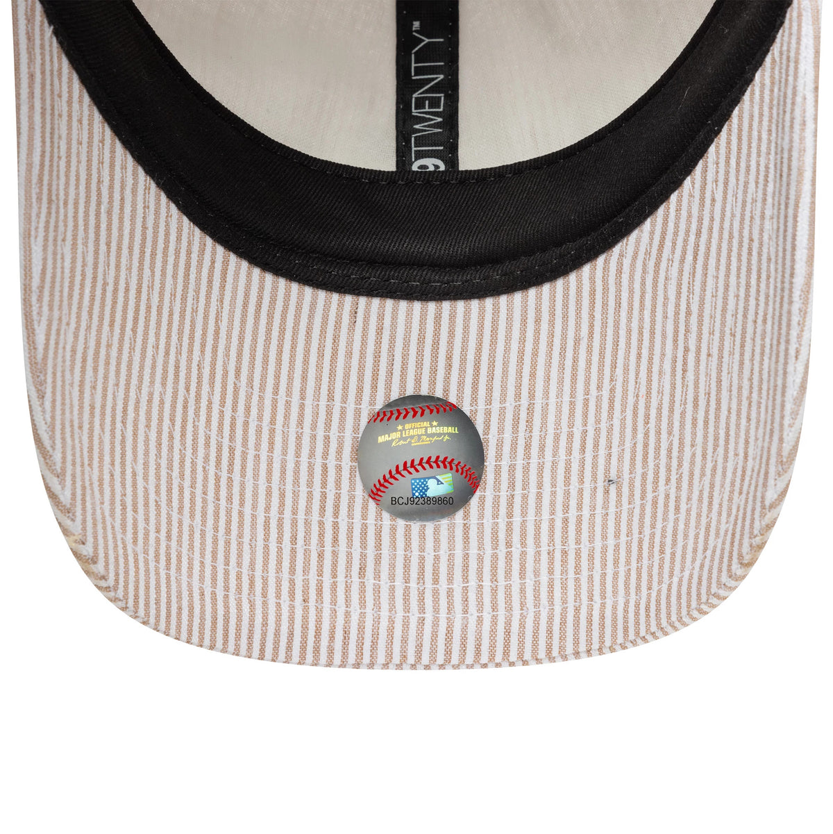 Athletics MLB Seersucker Light Beige New Era 9TWENTY Adjustable Cap, inside view with black sweatband and 9TWENTY taping, showing the MLB holographic sticker on the underside of the light beige striped visor.