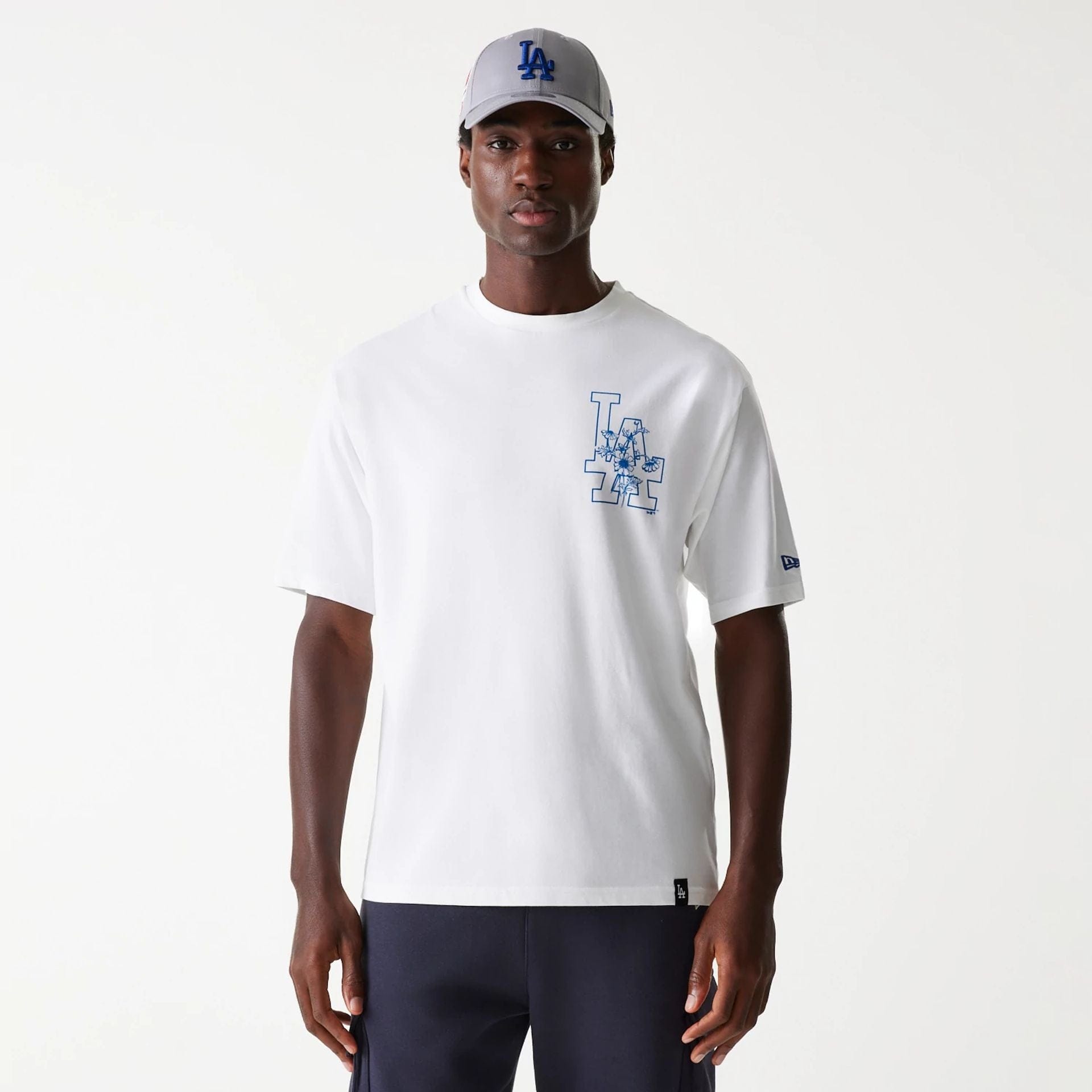 The Male model is wearing LA Dodgers MLB Floral Graphic White Oversized T-Shirt 1