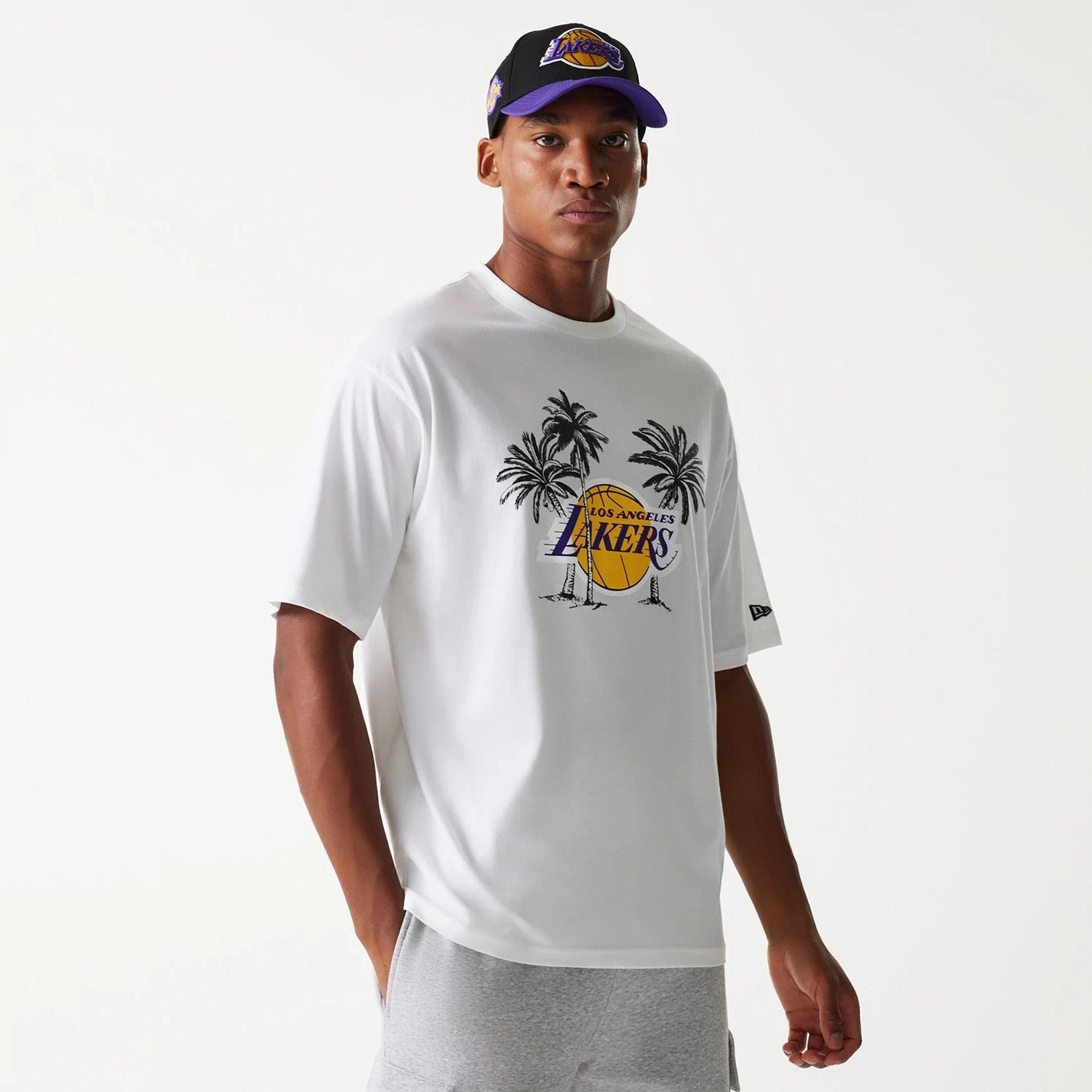 The Male model is wearing LA Lakers NBA Palm Tree White Oversized T-Shirt 1