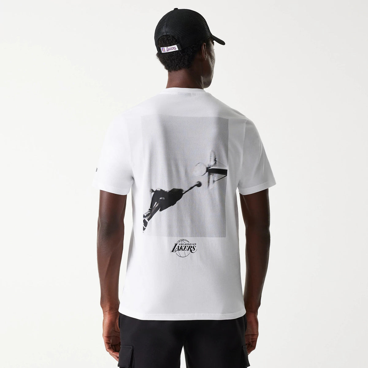 New Era LA Lakers NBA Court Graphic White T-Shirt, rear view showing a black-and-white graphic of a basketball player going for a dunk, with the team logo printed below the image on a plain white background.