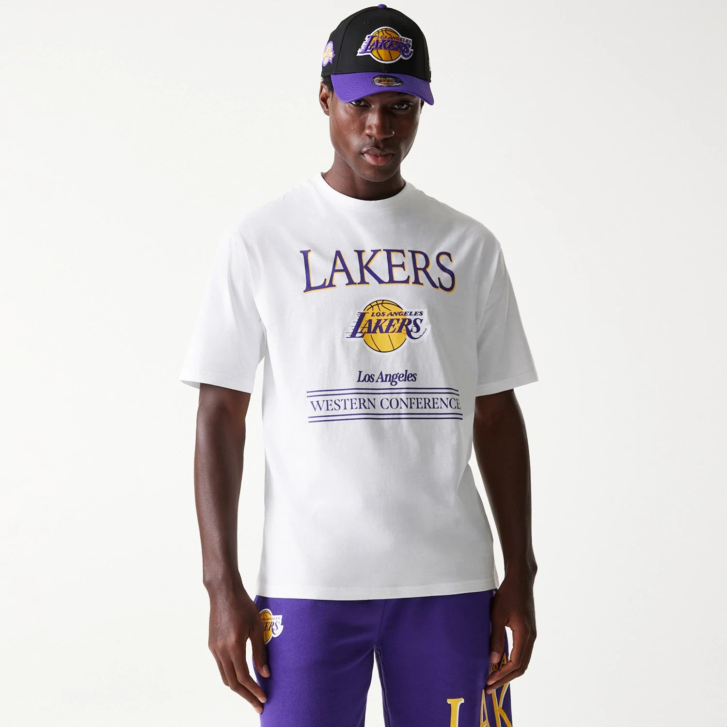 The Male model is wearing LA Lakers NBA Team Graphic White Oversized T-Shirt 1