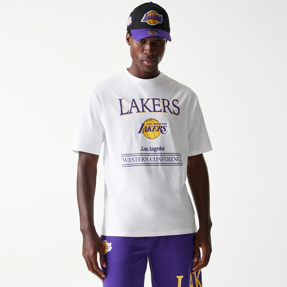 The Male model is wearing LA Lakers NBA Team Graphic White Oversized T-Shirt 1