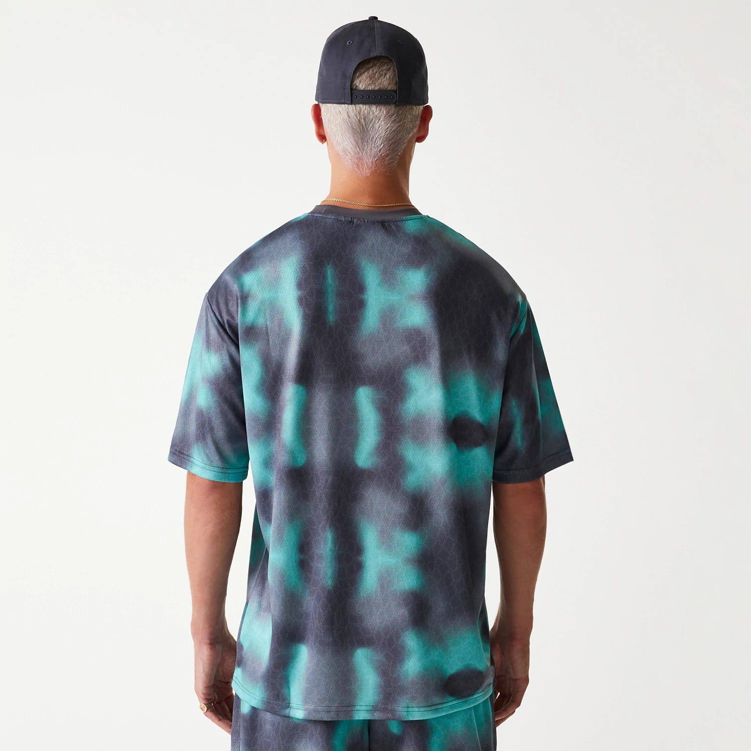 The Male model is wearing Chicago Bulls NBA All Over Print Green Oversized T-Shirt 2