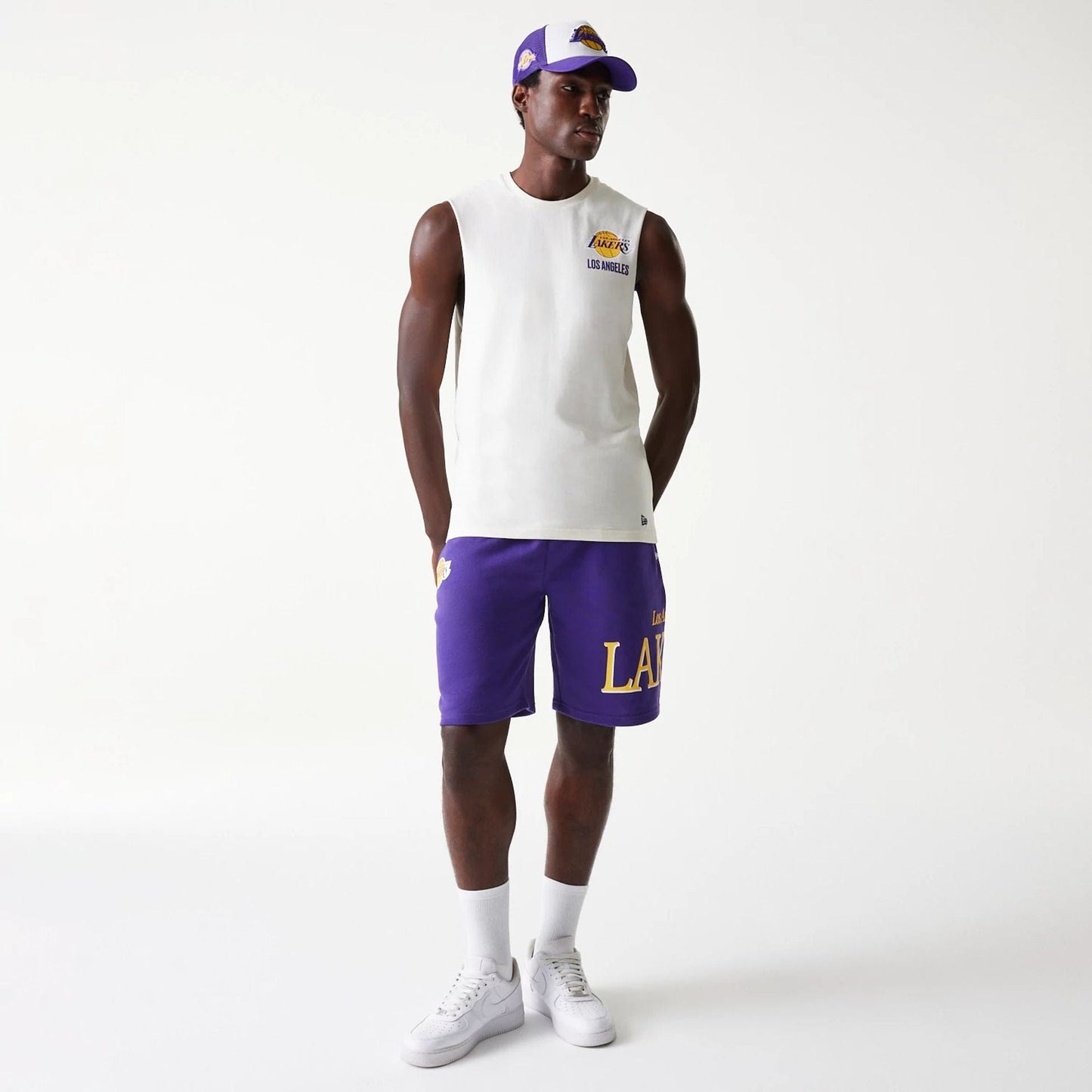 The Male model is wearing LA Lakers NBA Team Graphic Purple Shorts 8