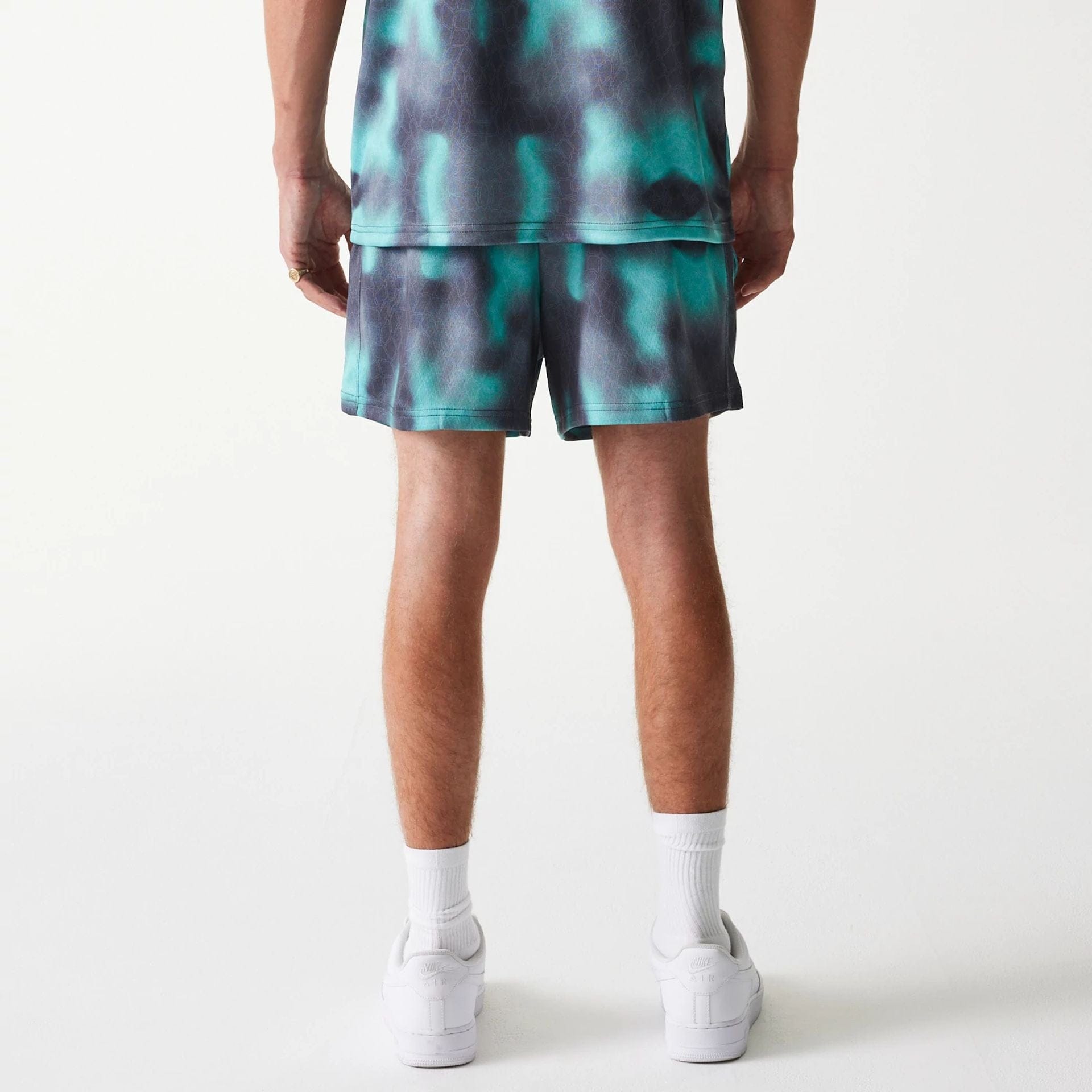 The Male model is wearing Chicago Bulls NBA All Over Print Green Shorts 2