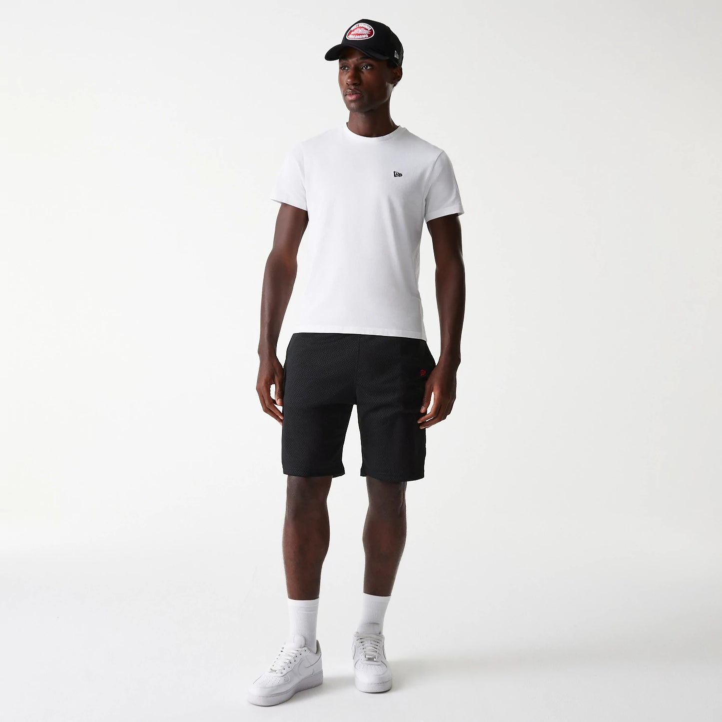 The Male model is wearing New Era Black Mesh Shorts 8