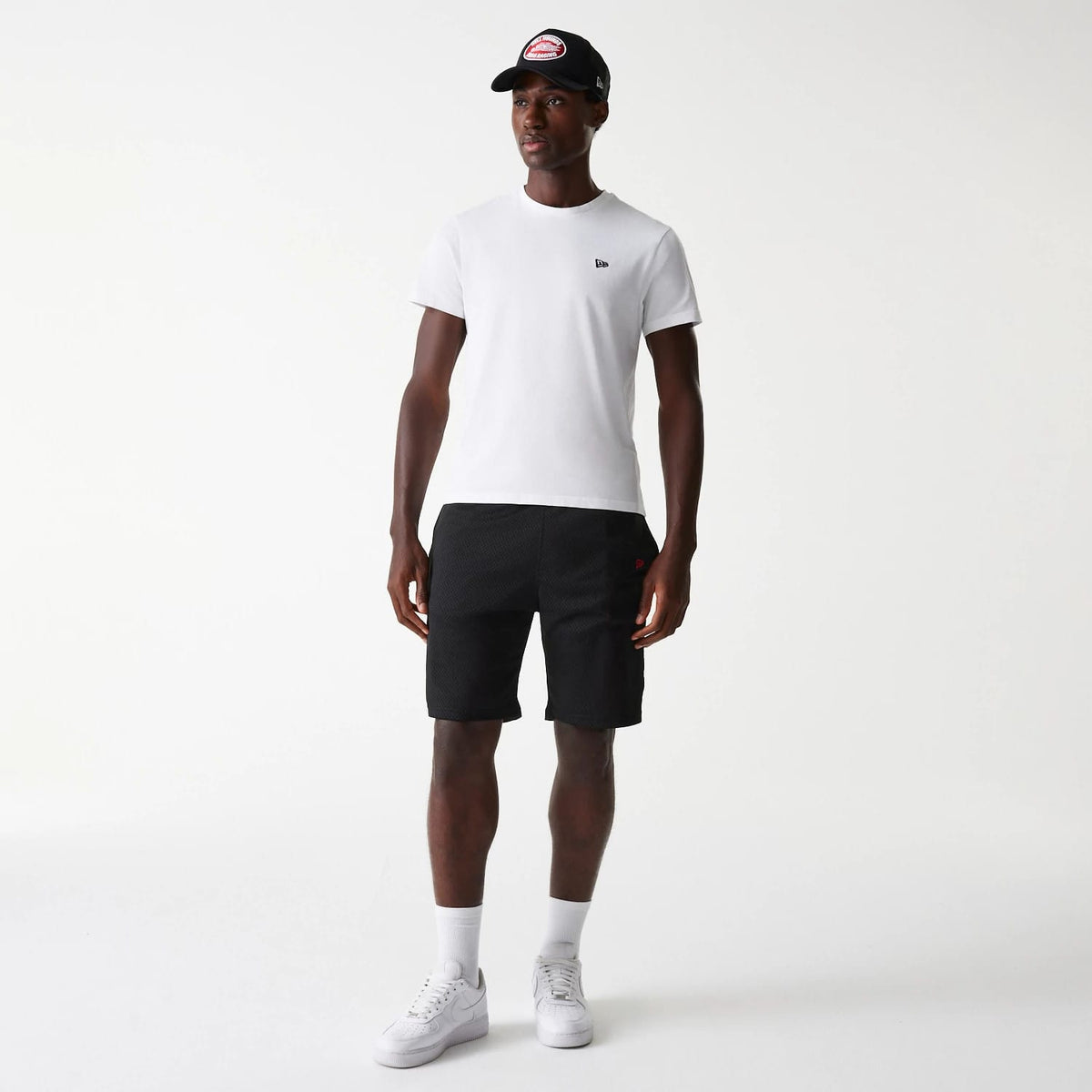 The Male model is wearing New Era Black Mesh Shorts 8