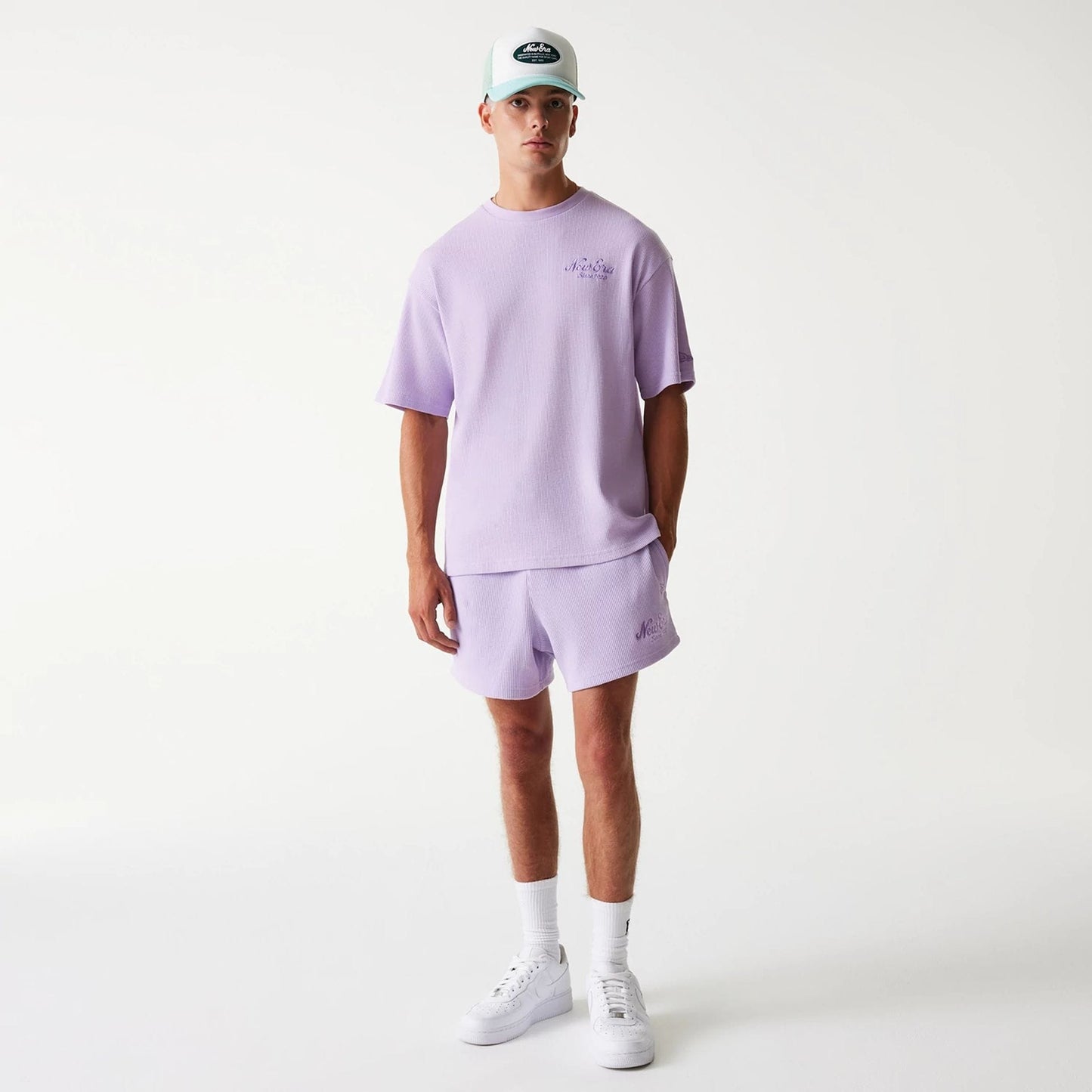 The Male model is wearing New Era Waffle Pastel Purple Oversized T-Shirt 8