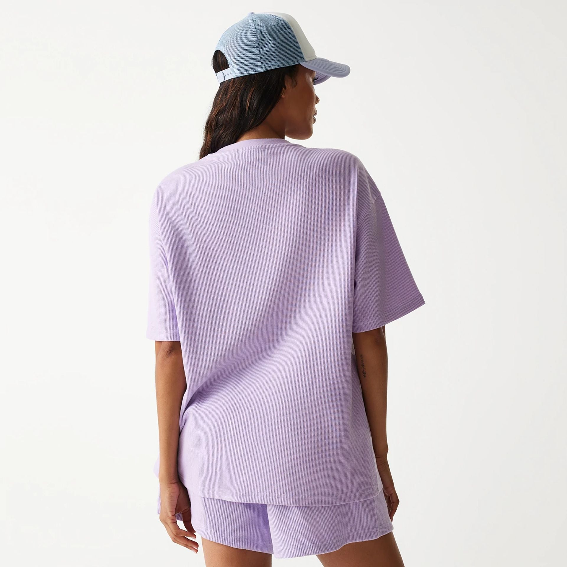 The Male model is wearing New Era Waffle Pastel Purple Oversized T-Shirt 2