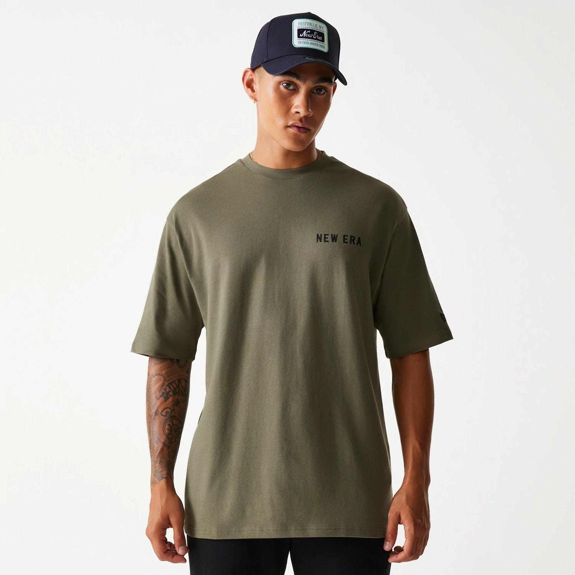 The Male model is wearing New Era Animal Graphic Green Oversized T-Shirt 1