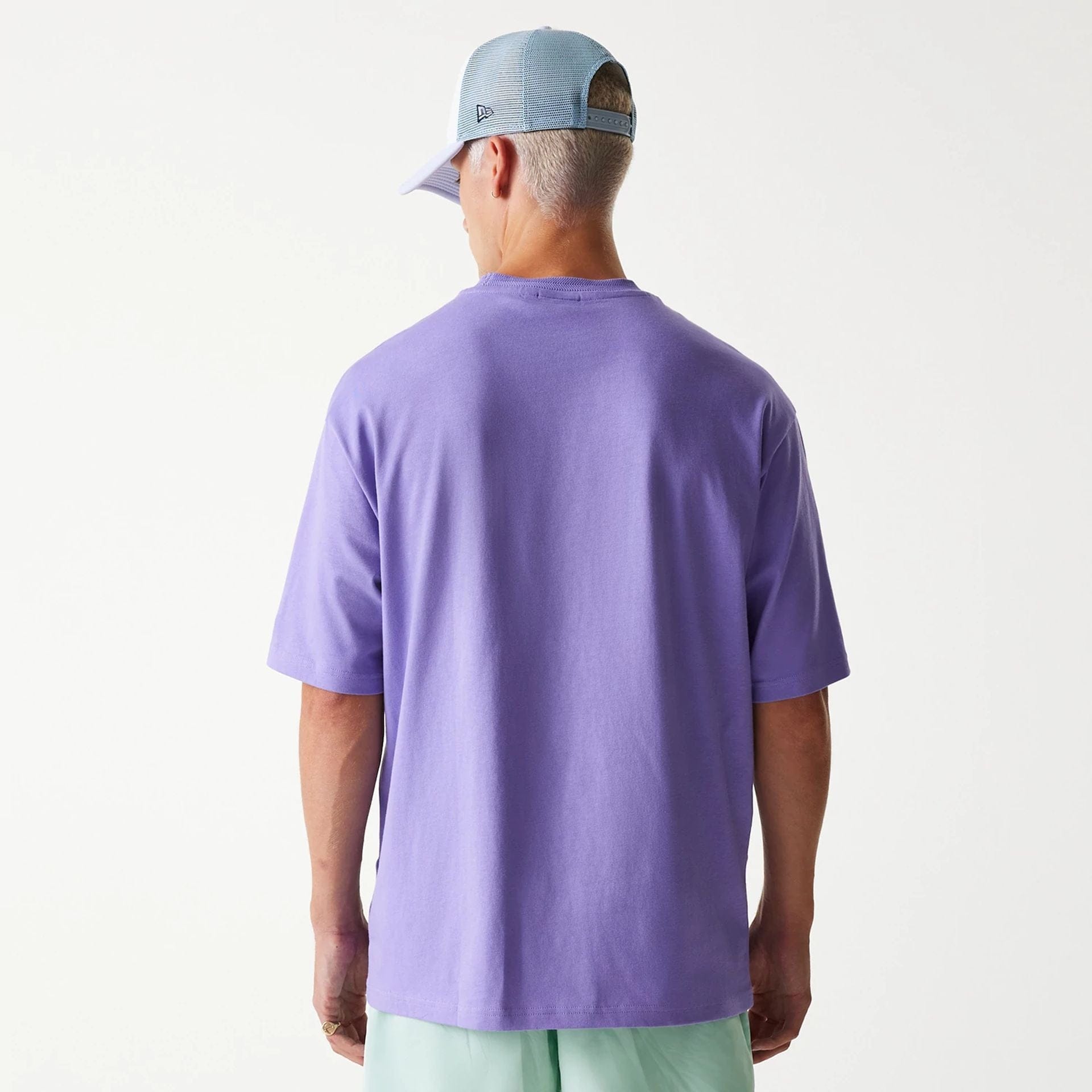 The Male model is wearing New Era Graphic Purple Oversized T-Shirt 2
