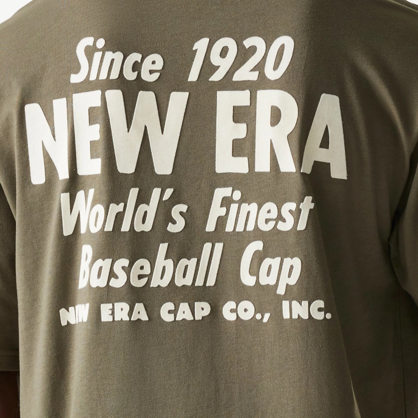 The Male model is wearing New Era Graphic Green Oversized T-Shirt 7
