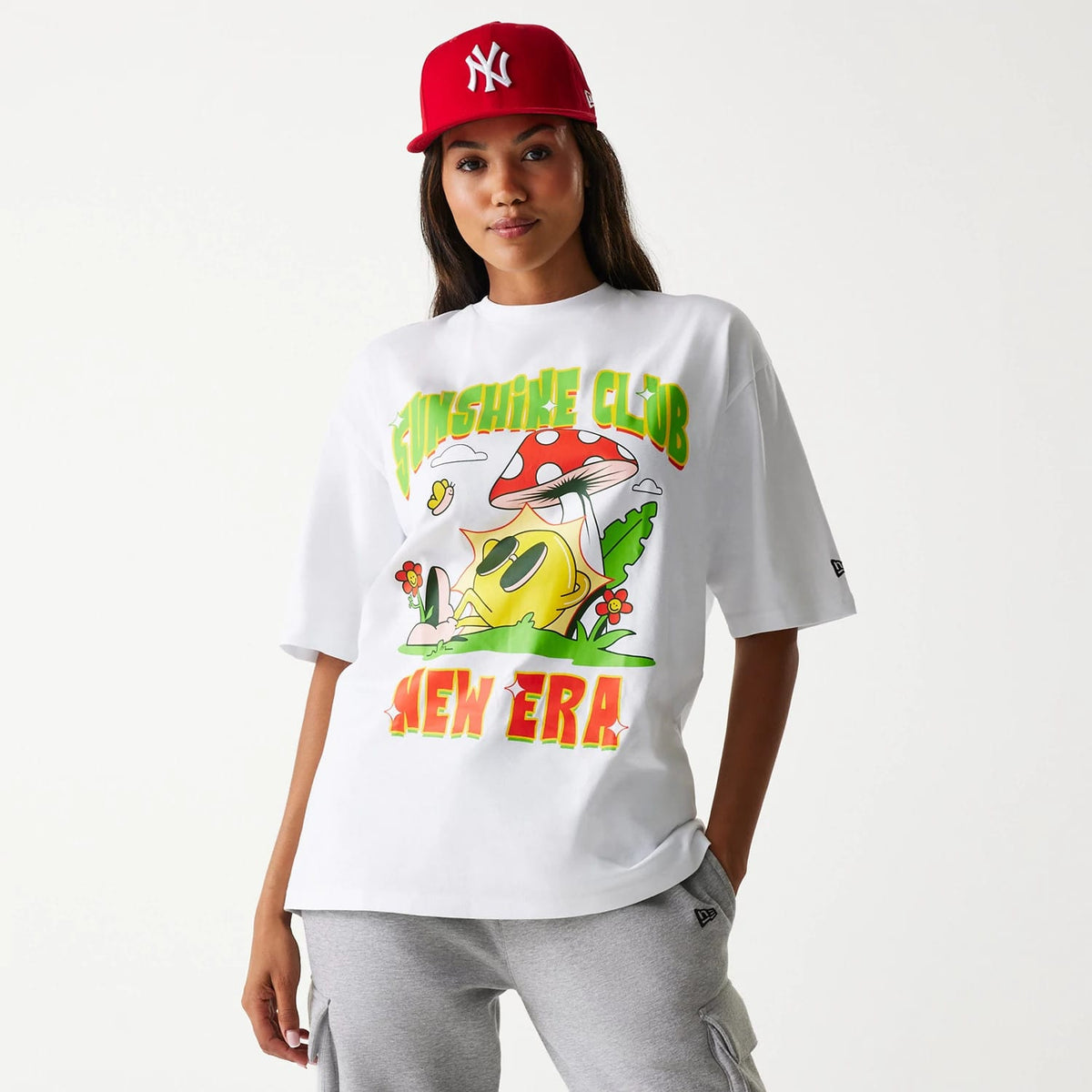 The Male model is wearing New Era Outdoor Graphic White Oversized T-Shirt 4