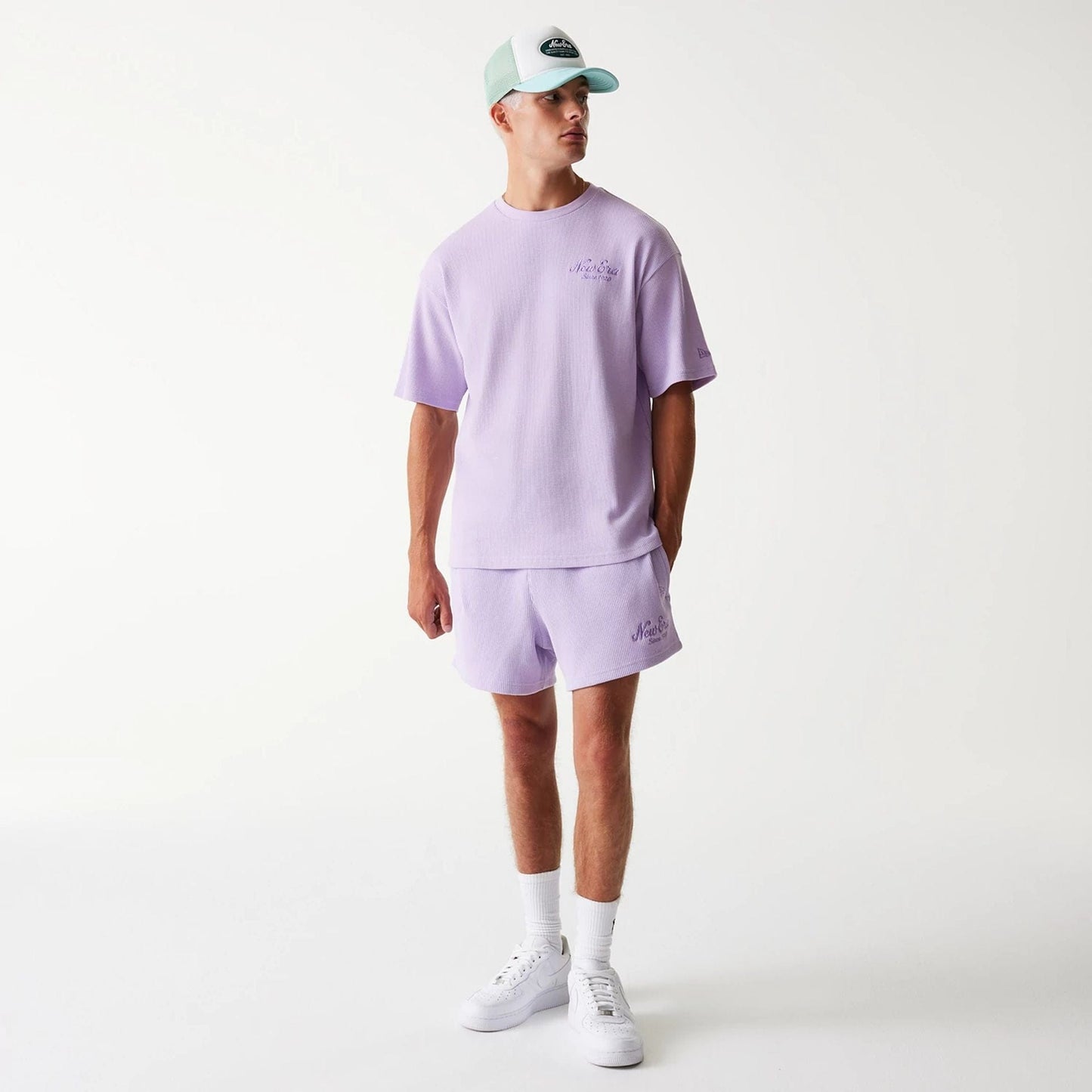 The Male model is wearing New Era Waffle Pastel Purple Shorts 8