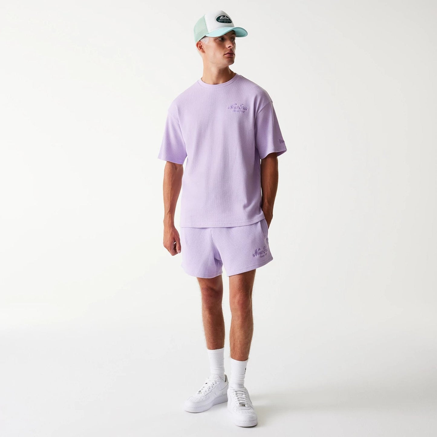 The Male model is wearing New Era Waffle Pastel Purple Shorts 8