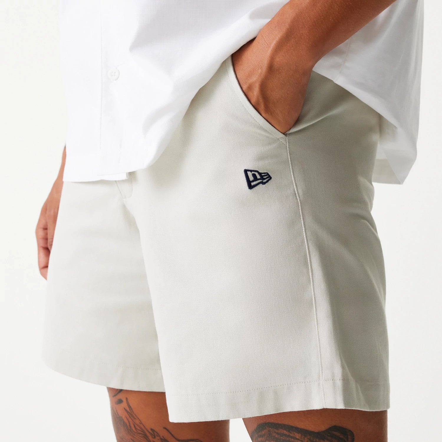 The Male model is wearing New Era Cream Chino Shorts 3