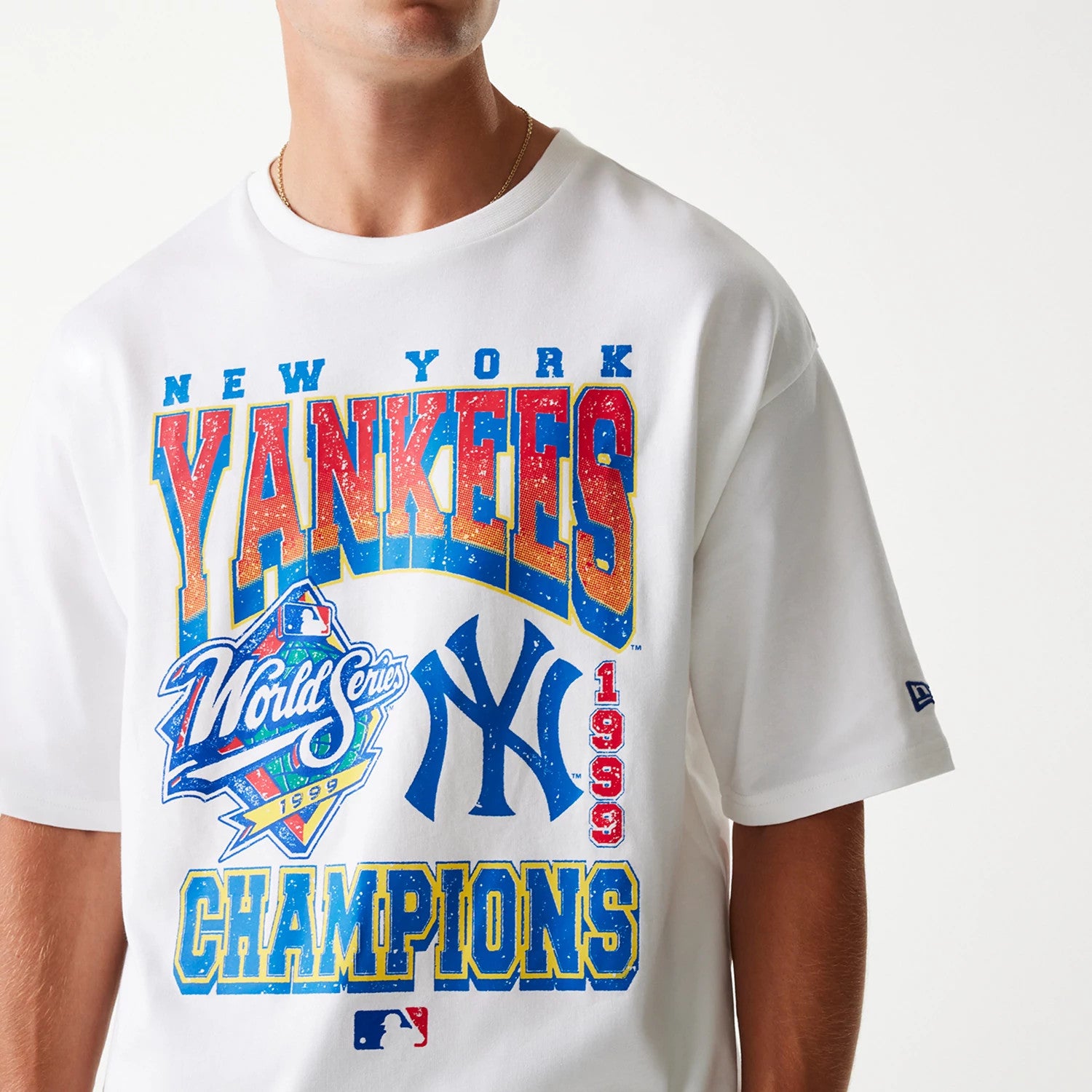 The Male model is wearing New York Yankees MLB World Series 1999 White Oversized T-Shirt 4