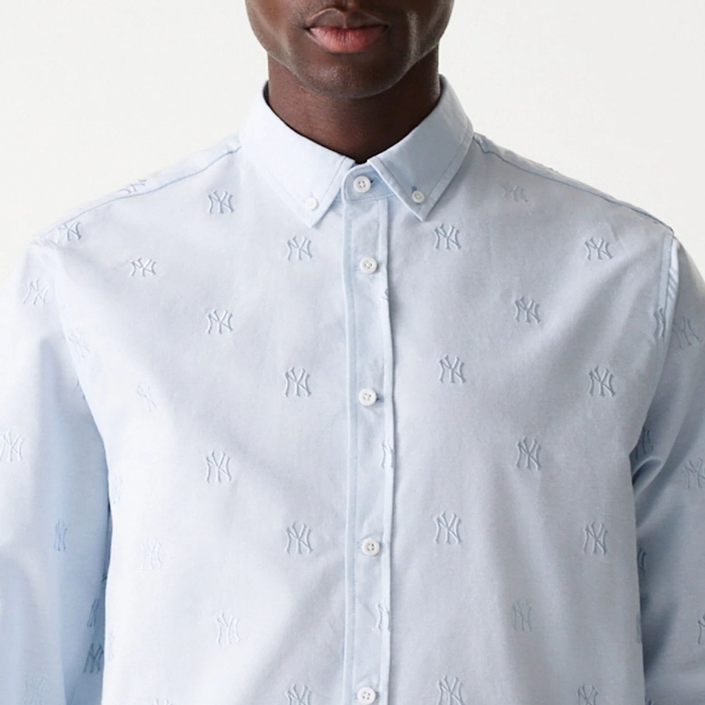 The Male model is wearing New York Yankees MLB Monogram Pastel Blue Long Sleeve Shirt 7