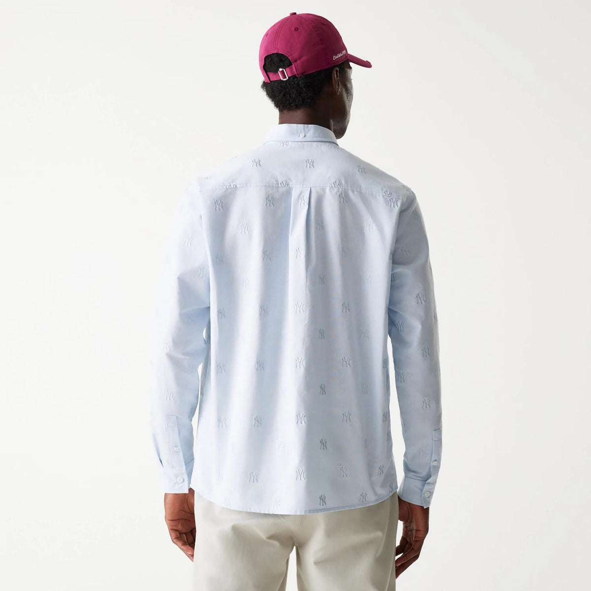 The Male model is wearing New York Yankees MLB Monogram Pastel Blue Long Sleeve Shirt 2