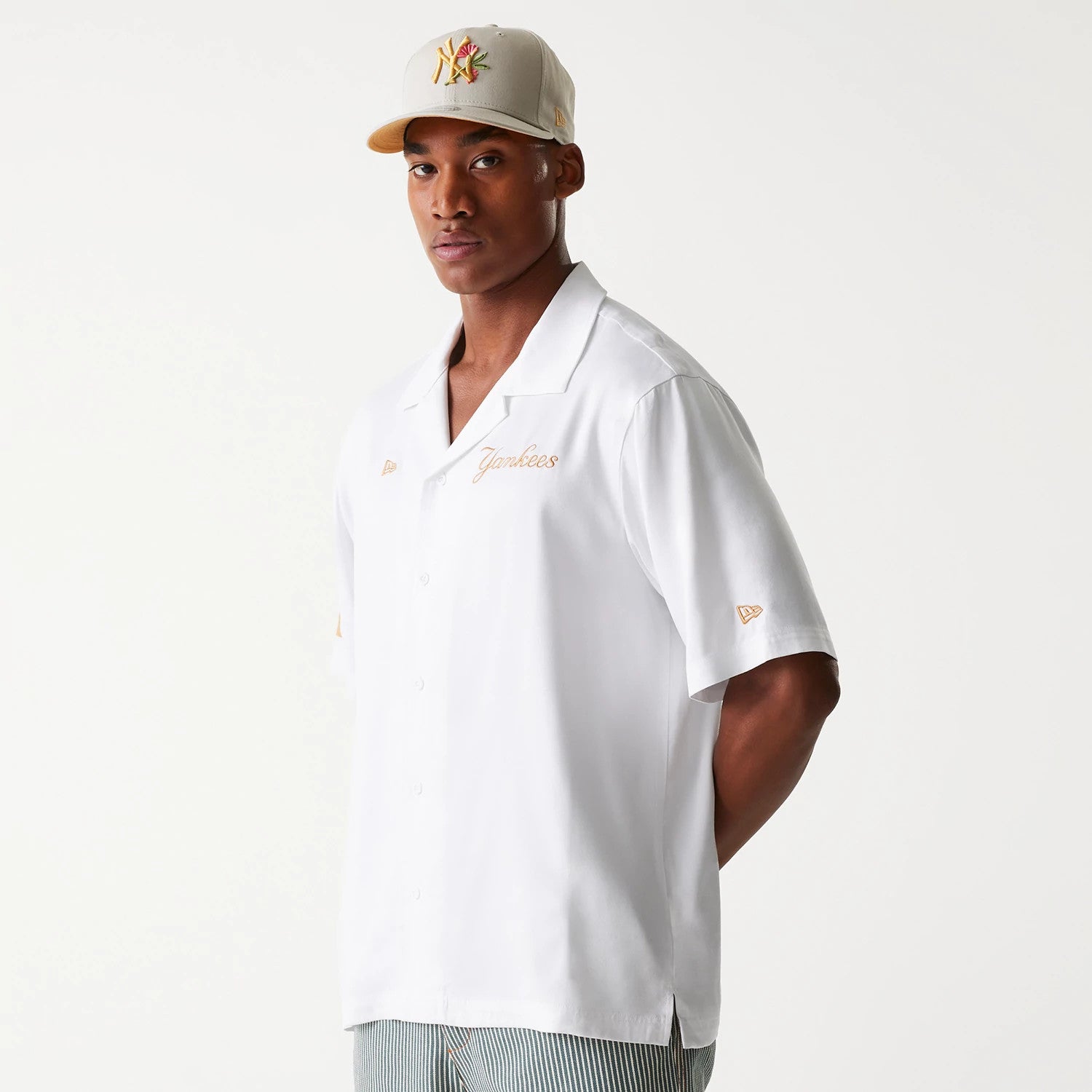 The Male model is wearing New York Yankees MLB Graphic White Revere Short Sleeve Shirt 3