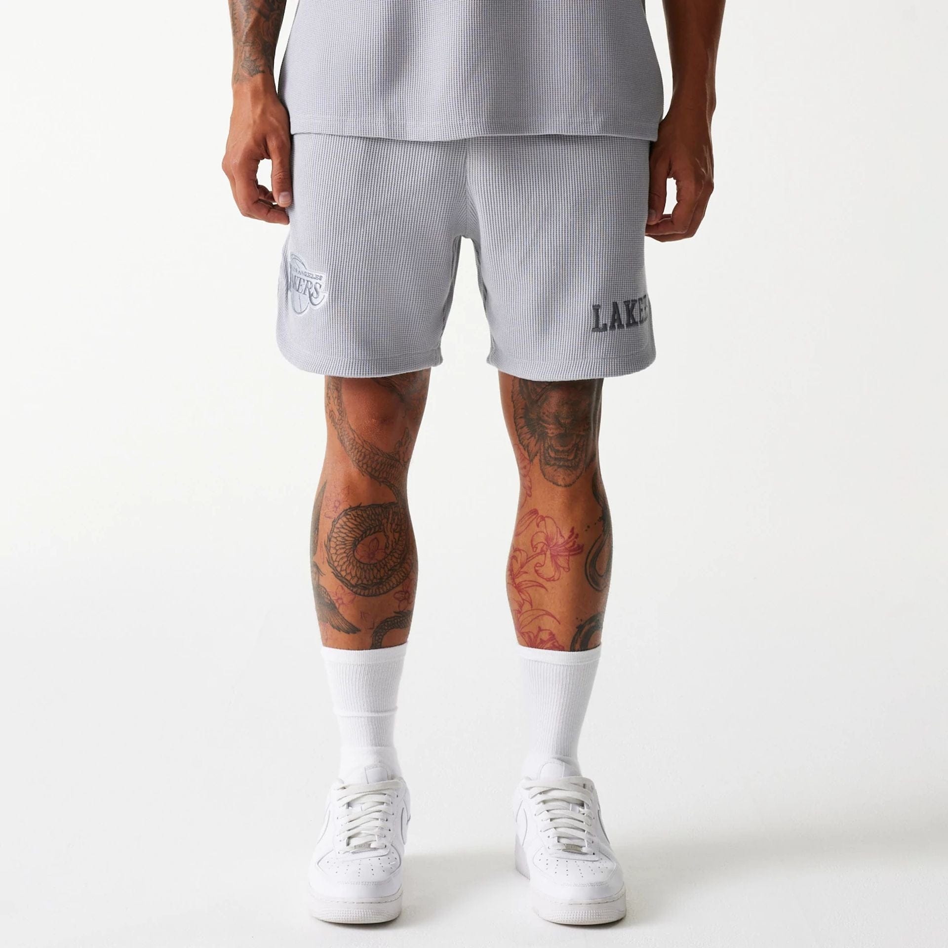 The Male model is wearing LA Lakers NBA Waffle Grey Shorts 1