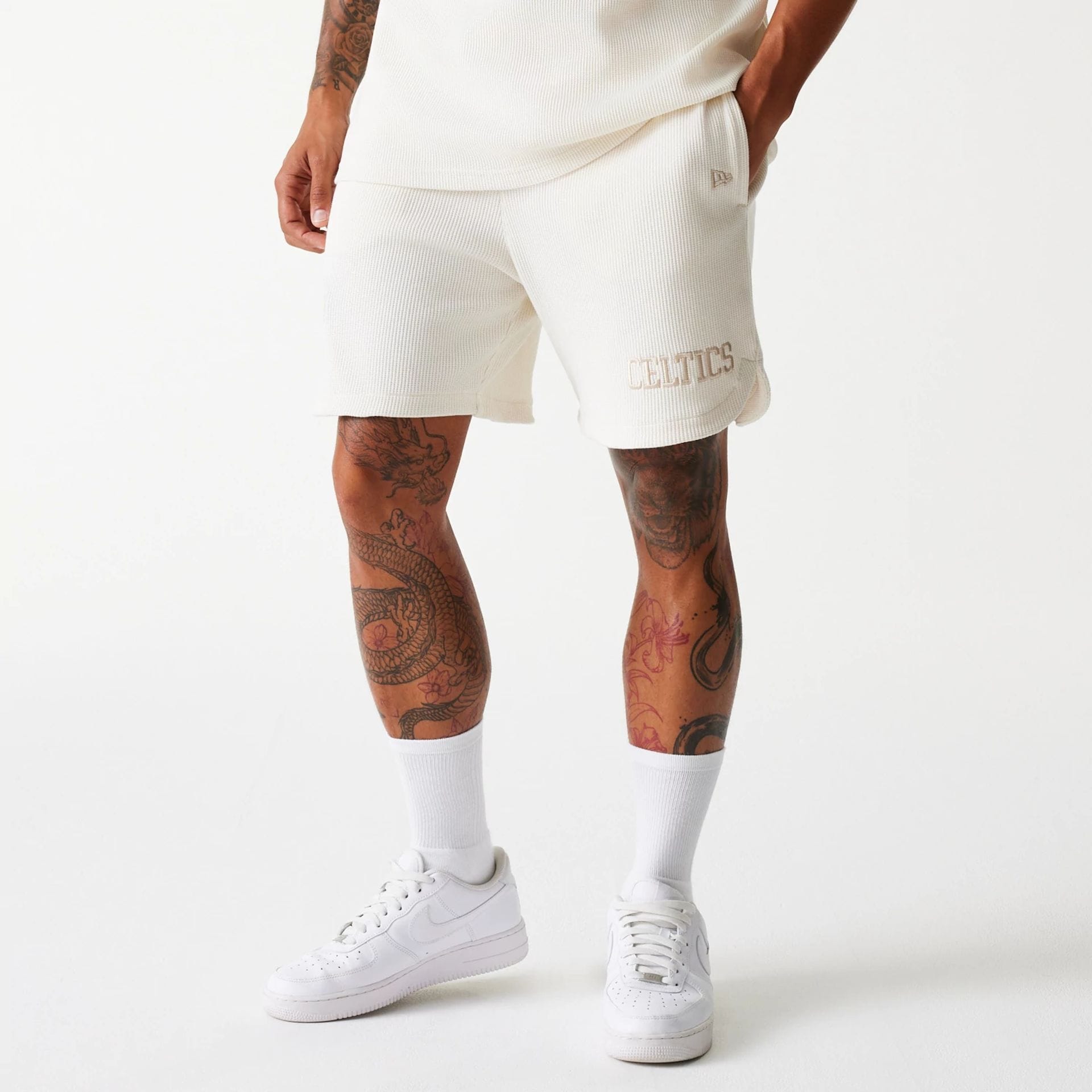 The Male model is wearing Boston Celtics NBA Waffle Open White Shorts 1