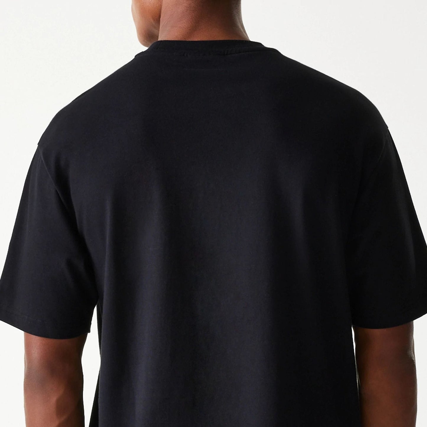 The Male model is wearing Las Vegas Raiders NFL Helmet Black Oversized T-Shirt 7