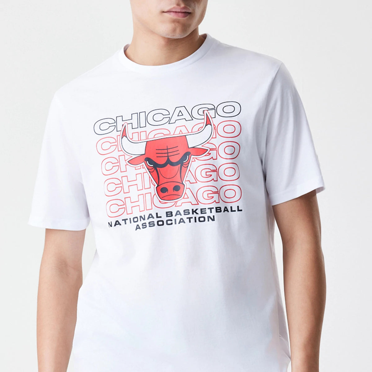 New Era Chicago Bulls NBA Stack Wordmark White T-Shirt, front view showing the large centred red and black Chicago Bulls logo with stacked wordmark design and National Basketball Association text below on a plain white background.