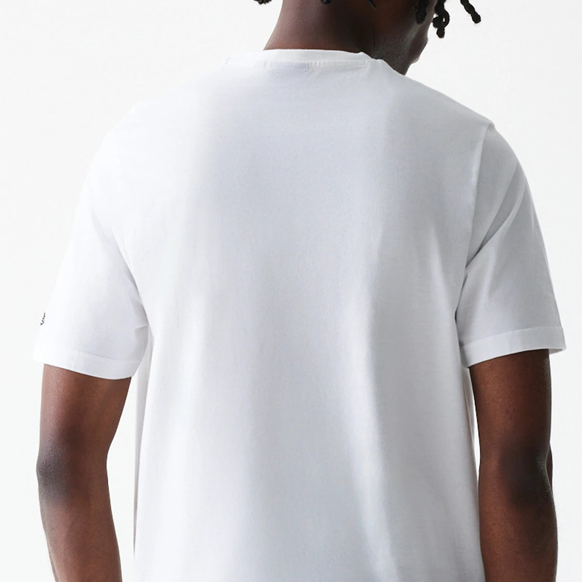 New Era Chicago Bulls NBA Logo White T-Shirt, rear view showing the plain white fabric extending smoothly across the back, with short sleeves and a small debossed logo on the left sleeve near the hem.