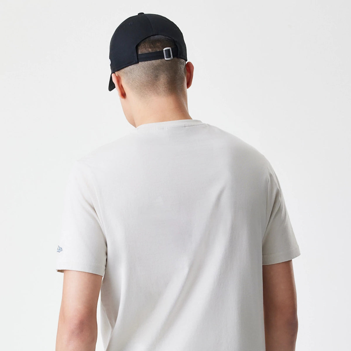 The Male model is wearing New Era Burger Graphic Cream T-Shirt 7
