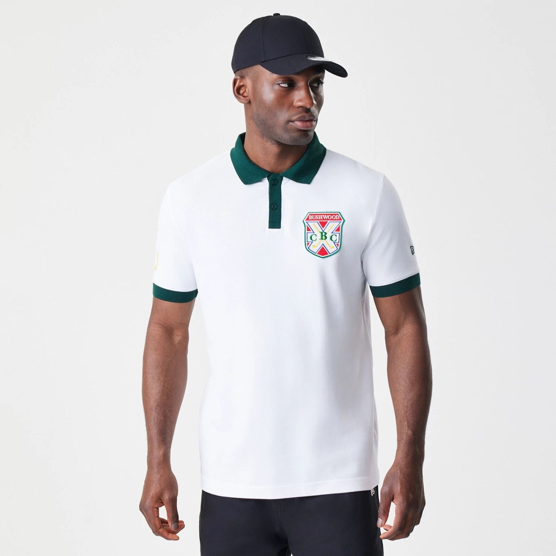The Male model is wearing Caddyshack BushWood White Polo T-Shirt 1