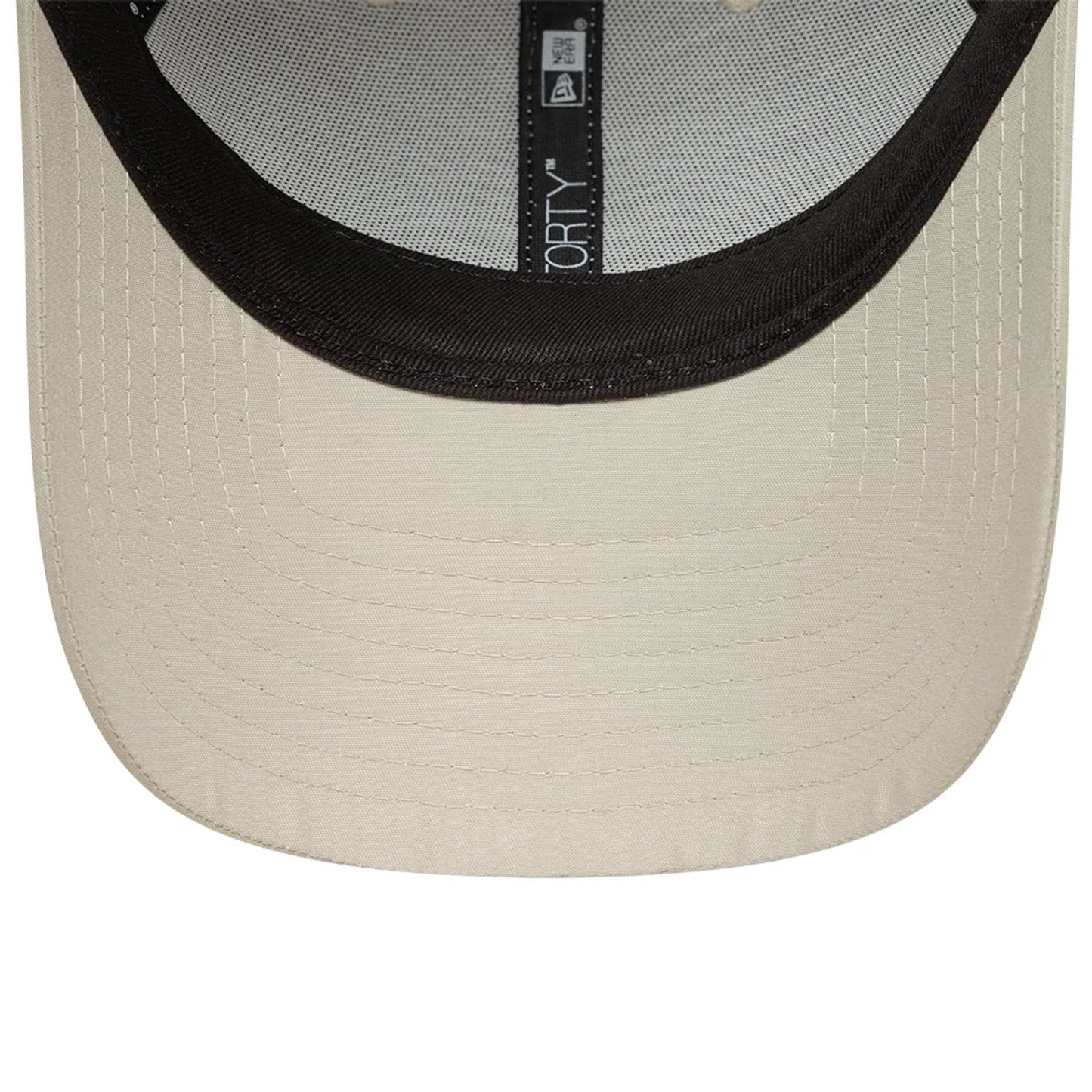 New York Yankees MLB Flawless Cream New Era 9FORTY Adjustable Cap, inside view showing black taping with the 9FORTY logo, black sweatband, and light cream undervisor with detailed stitching.