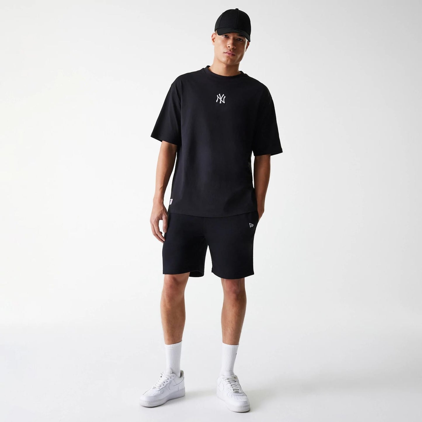 The Male model is wearing New York Yankees MLB League Essential Black Oversized T-Shirt 8