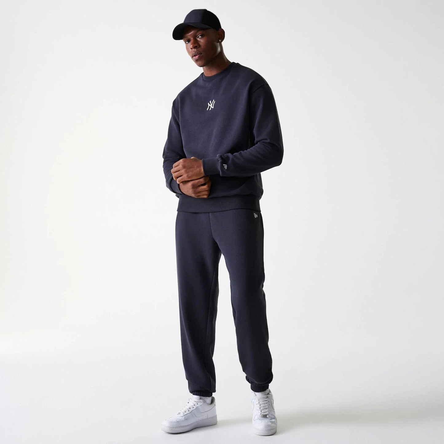 The Male model is wearing New York Yankees MLB League Essential Navy Crew Neck Sweater 8