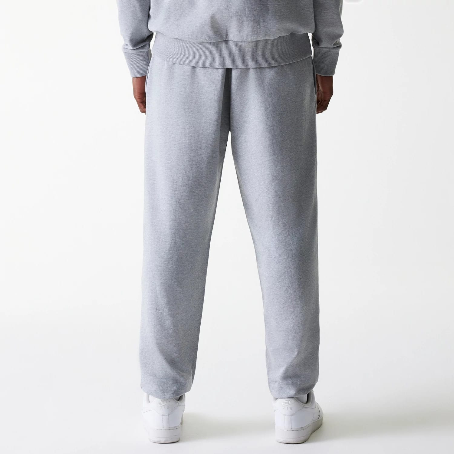 The Male model is wearing New York Yankees MLB League Essential Midi Grey Joggers 2