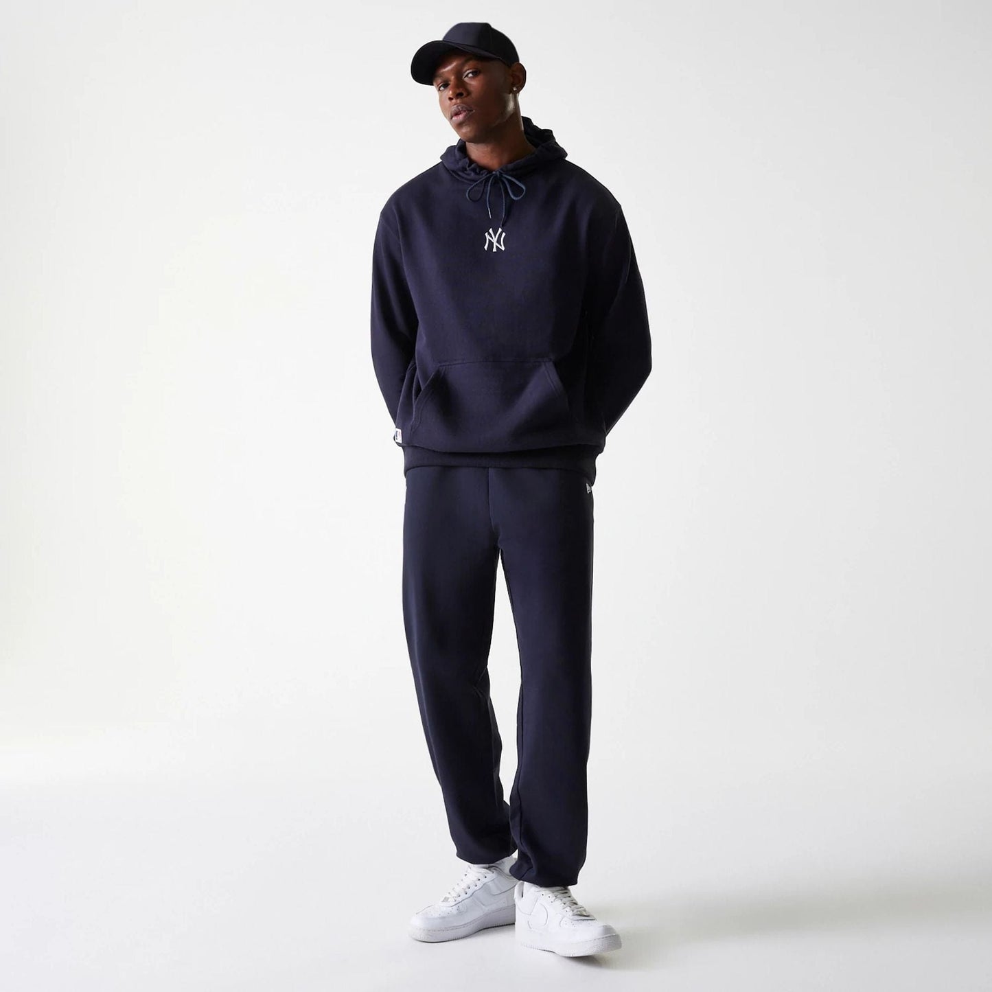 The Male model is wearing New York Yankees MLB League Essential Midi Navy Joggers 8