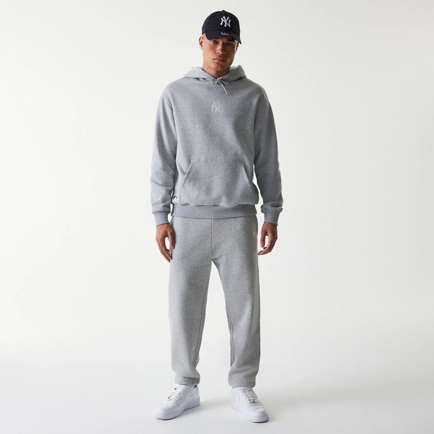 The Male model is wearing New York Yankees MLB League Essential Grey Oversized Pullover Hoodie 8