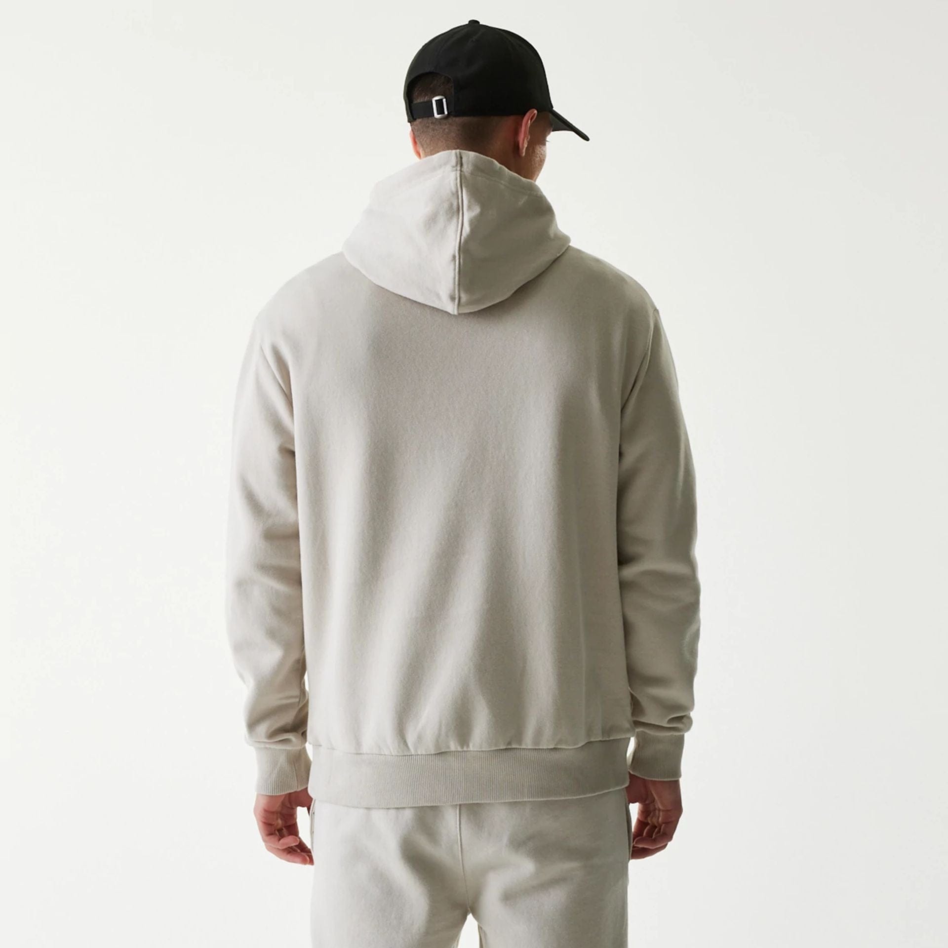 The Male model is wearing New York Yankees MLB League Essential Cream Oversized Pullover Hoodie 2