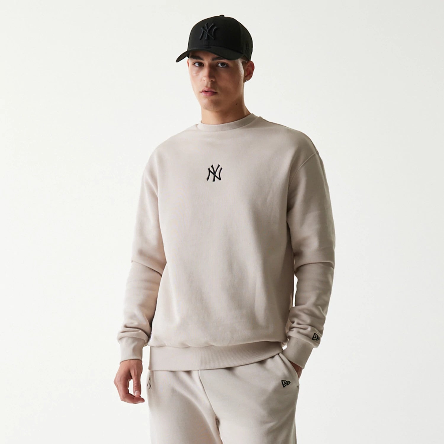 The Male model is wearing New York Yankees MLB League Essential Midi Cream Oversized Crew Neck Sweater 3